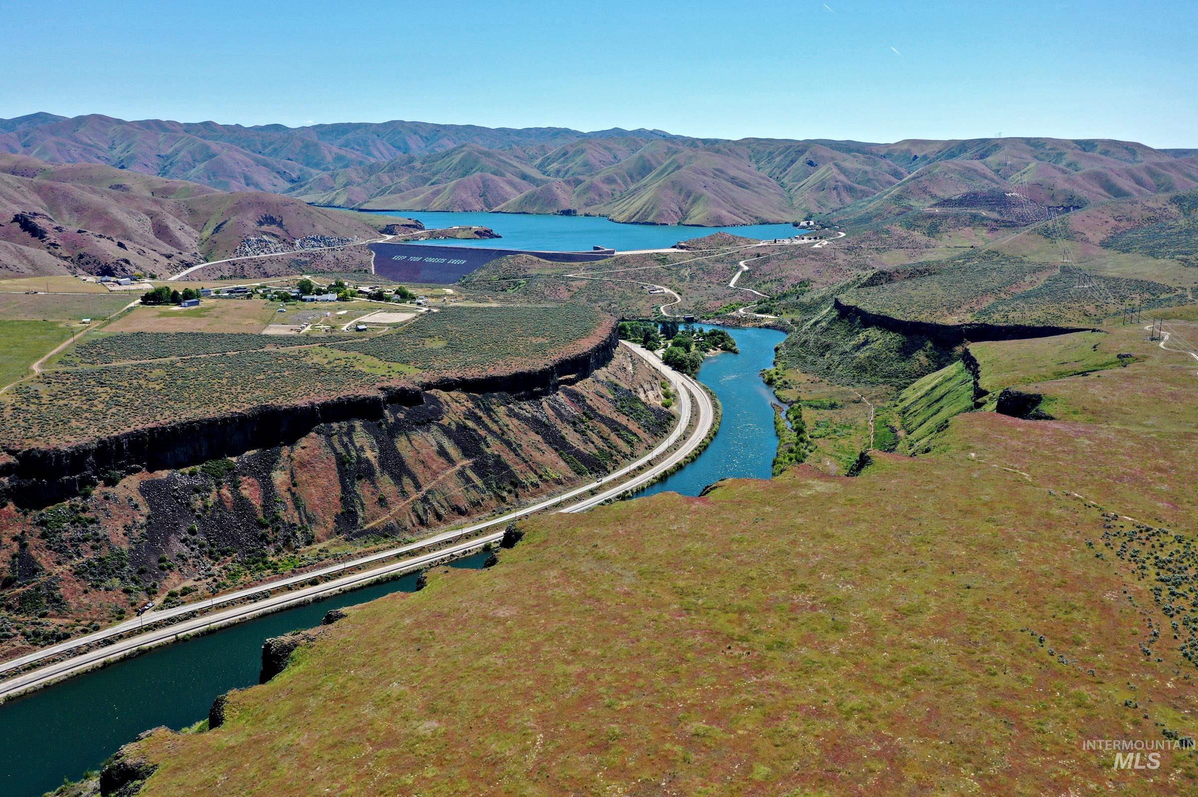7213 East Columbia Road Boise, ID 83716 - Photo 46 of 47 Expansive arid landscape featuring a prominent river winding through a canyon