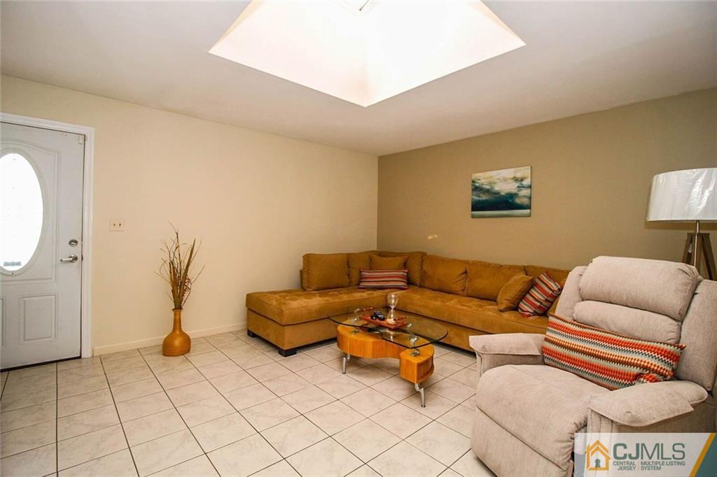 155 Princeton Road Old Bridge, NJ 08859 - Photo 13 of 18 a living room with furniture and a rug
