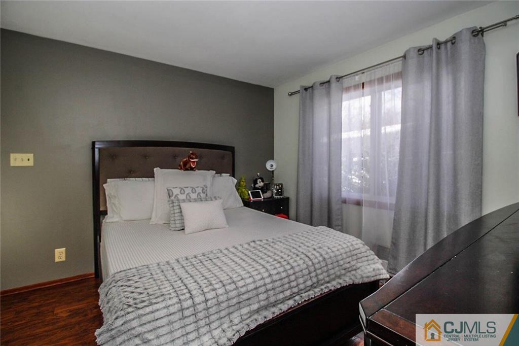 155 Princeton Road Old Bridge, NJ 08859 - Photo 17 of 18 a bedroom with a bed and wooden floor