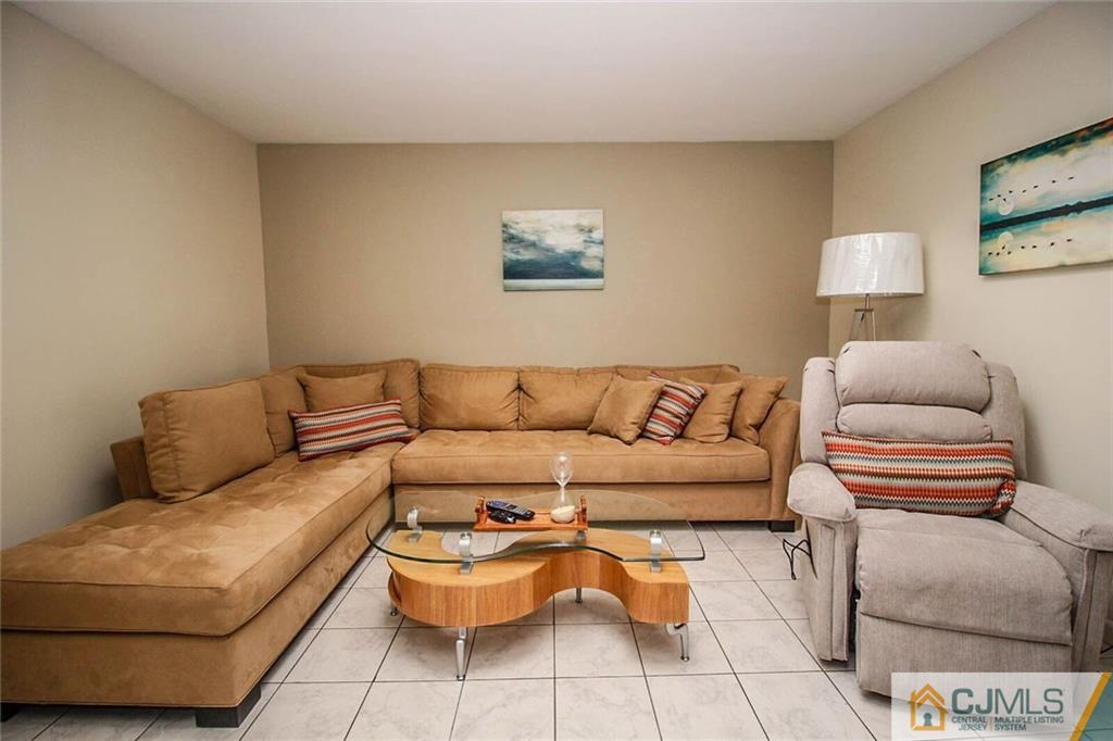 155 Princeton Road Old Bridge, NJ 08859 - Photo 4 of 18 a living room with furniture and a lamp