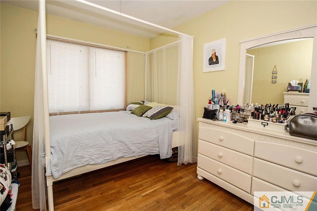 155 Princeton Road Old Bridge, NJ 08859 - Photo 8 of 18 a bedroom with a bed and a dresser