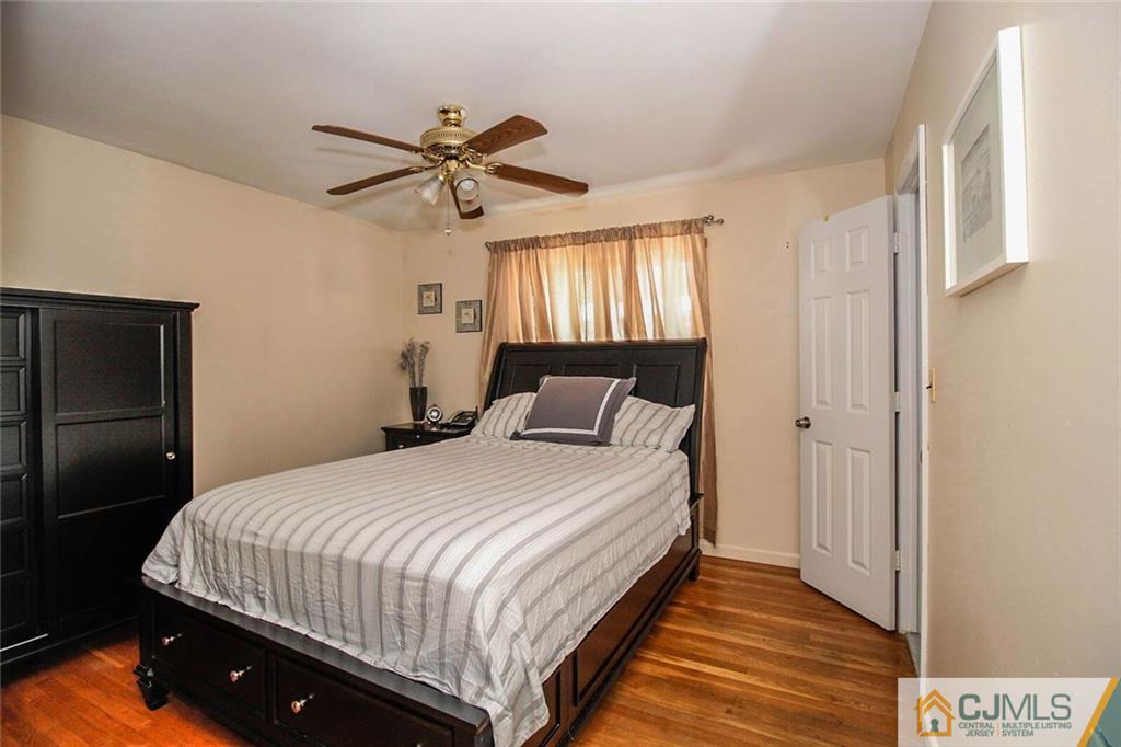 155 Princeton Road Old Bridge, NJ 08859 - Photo 10 of 18 a bedroom with a bed and a window