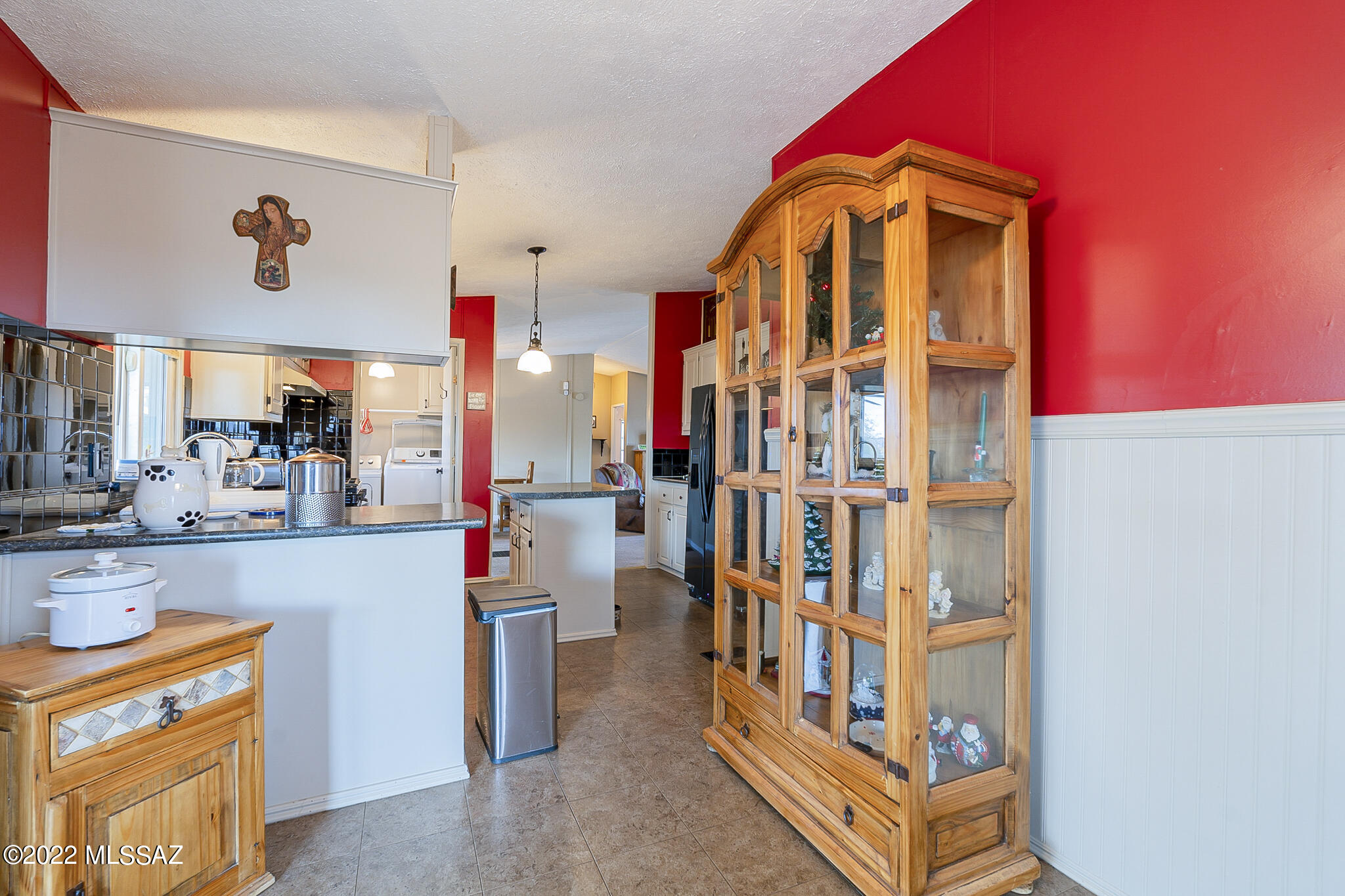 5285 North Puma Road Marana, AZ 85653 - Photo 16 of 46 a view of living room with stainless steel appliances wooden floor and seating area