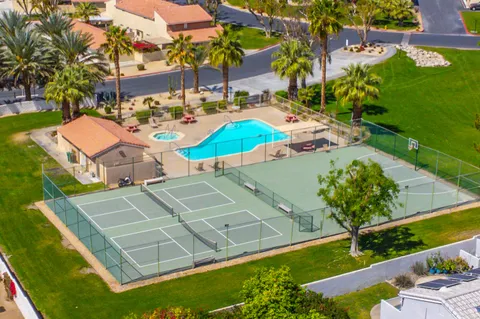 a view of staircase with railing and white walls