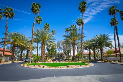 a front view of house with yard and outdoor seating