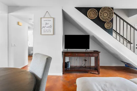 a kitchen with granite countertop a stove top oven sink and cabinets