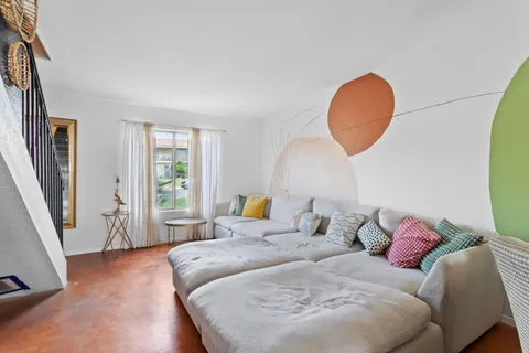 a bathroom with a bathtub shower sink and mirror