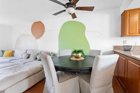a bathroom with a sink vanity and toilet
