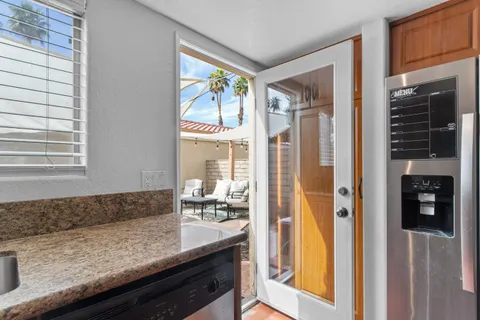 a bathroom with a sink vanity and mirror