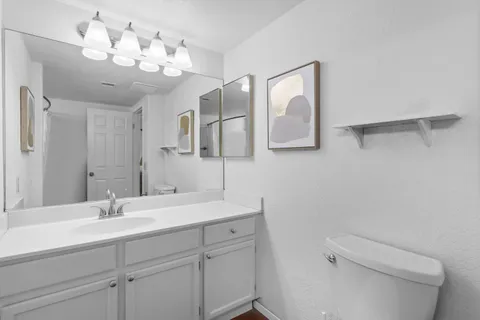 a bathroom with a double vanity sink and mirror