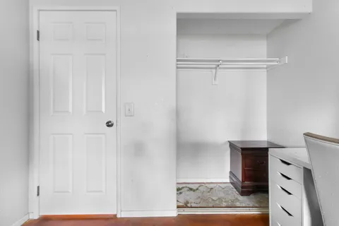 a balcony with furniture and wooden floor