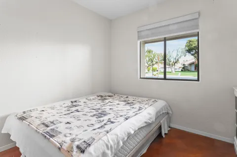 a view of a patio with table and chairs and potted plants