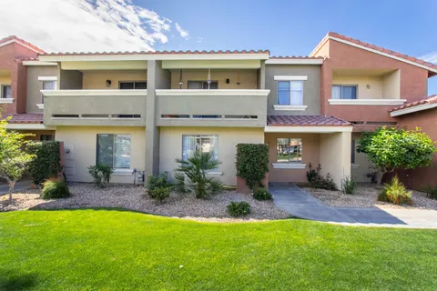 an aerial view of residential houses with outdoor space and street view