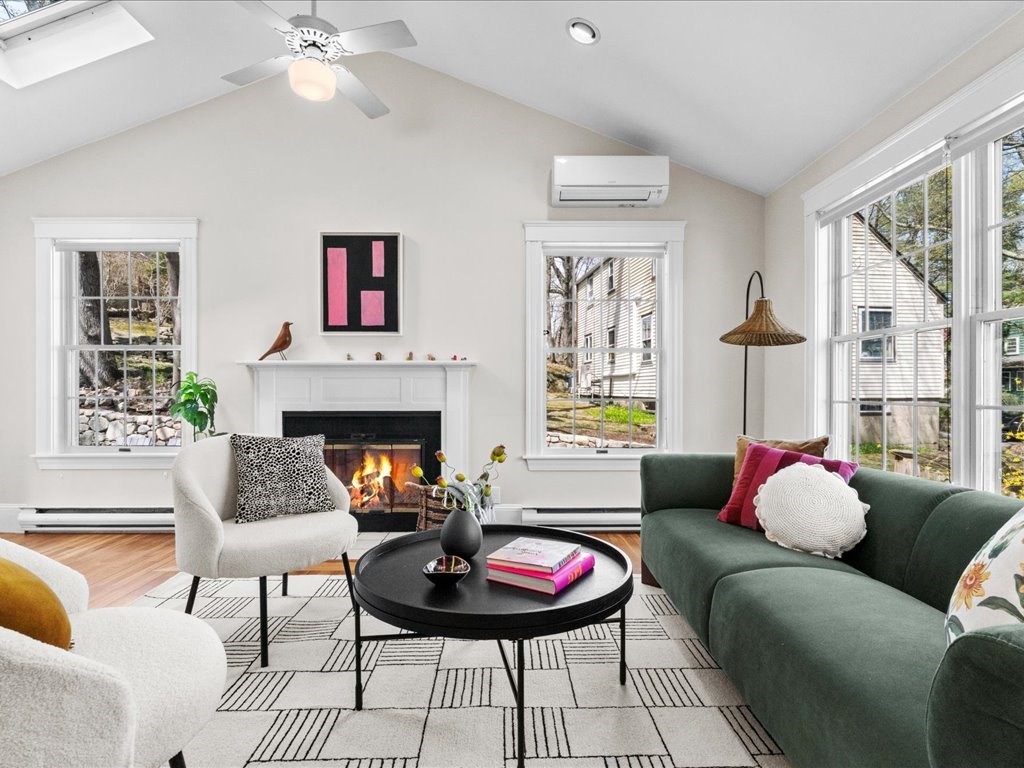 55 Coolidge Road Arlington, MA 02476 - Photo 11 of 42 a living room with furniture and a fireplace