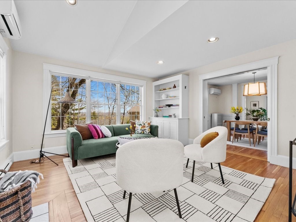 55 Coolidge Road Arlington, MA 02476 - Photo 12 of 42 a living room with furniture and a rug