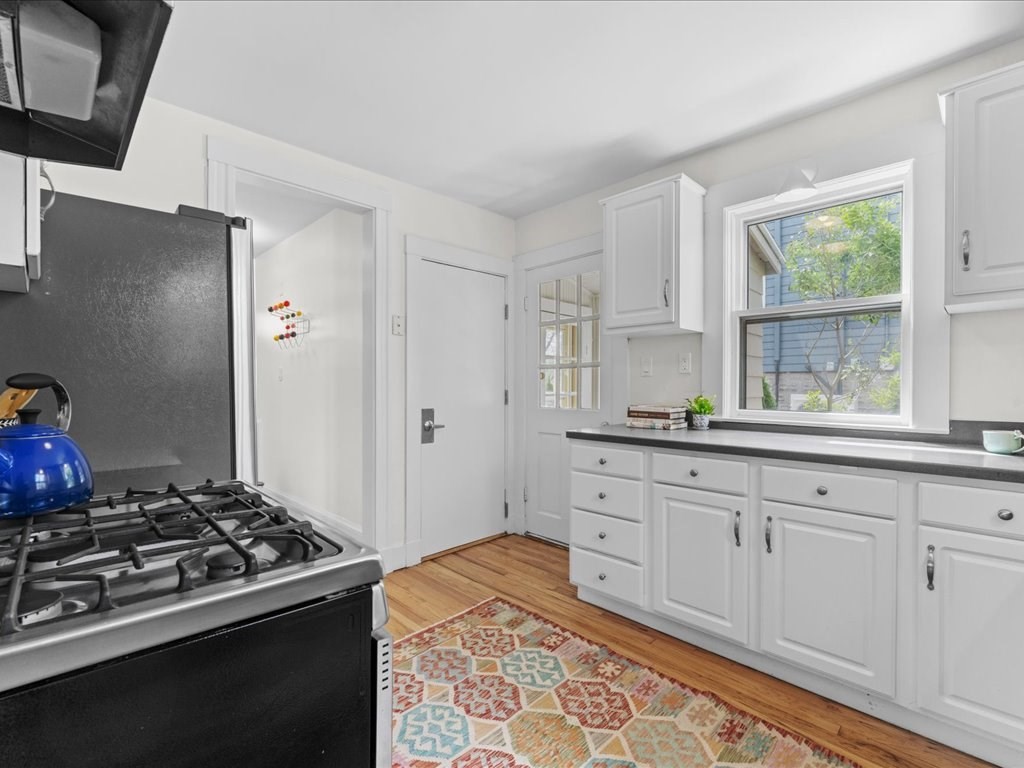 55 Coolidge Road Arlington, MA 02476 - Photo 17 of 42 a kitchen with sink stove and refrigerator