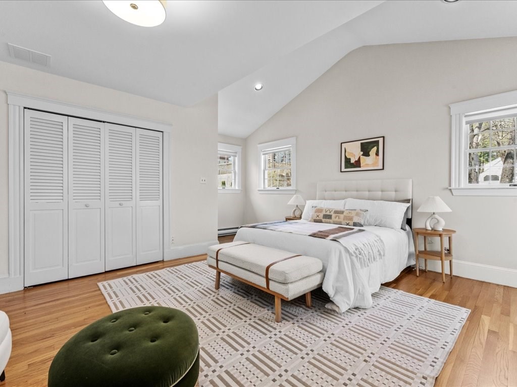 55 Coolidge Road Arlington, MA 02476 - Photo 21 of 42 a bedroom with bed and a couch