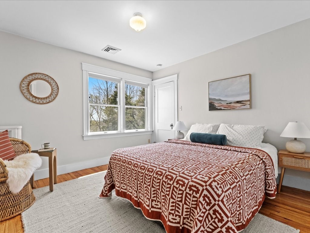 55 Coolidge Road Arlington, MA 02476 - Photo 23 of 42 a bedroom with a bed and a window