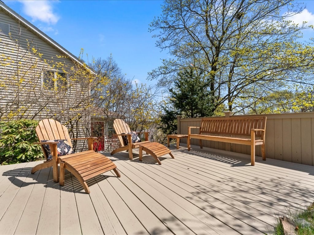 55 Coolidge Road Arlington, MA 02476 - Photo 3 of 42 a view of a wooden deck with a bench