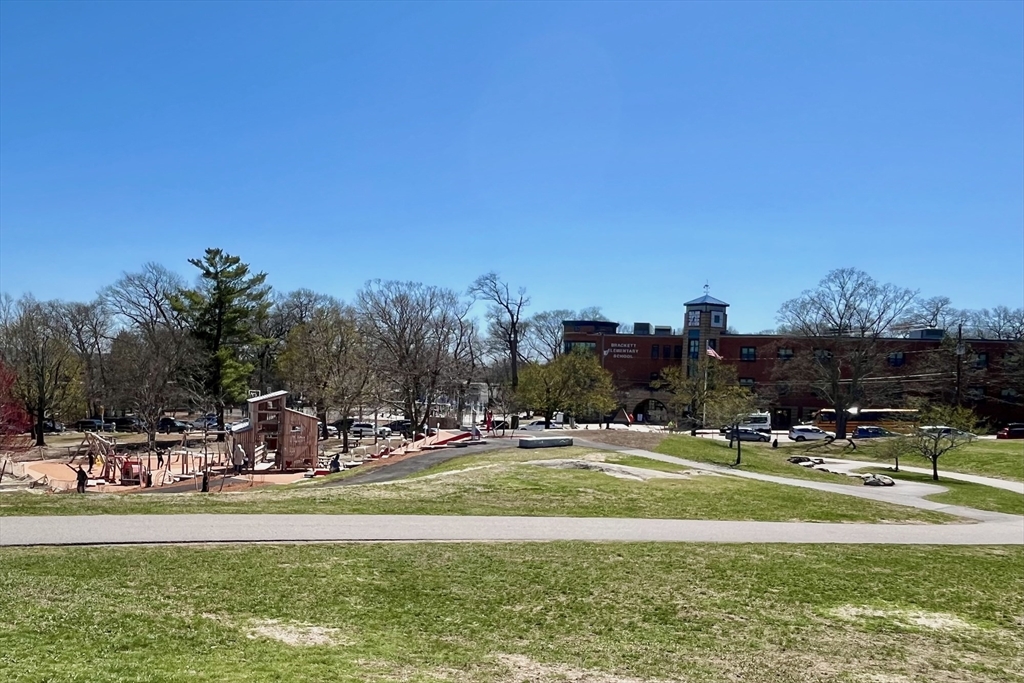 55 Coolidge Road Arlington, MA 02476 - Photo 42 of 42 a view of swimming pool with outdoor seating and trees