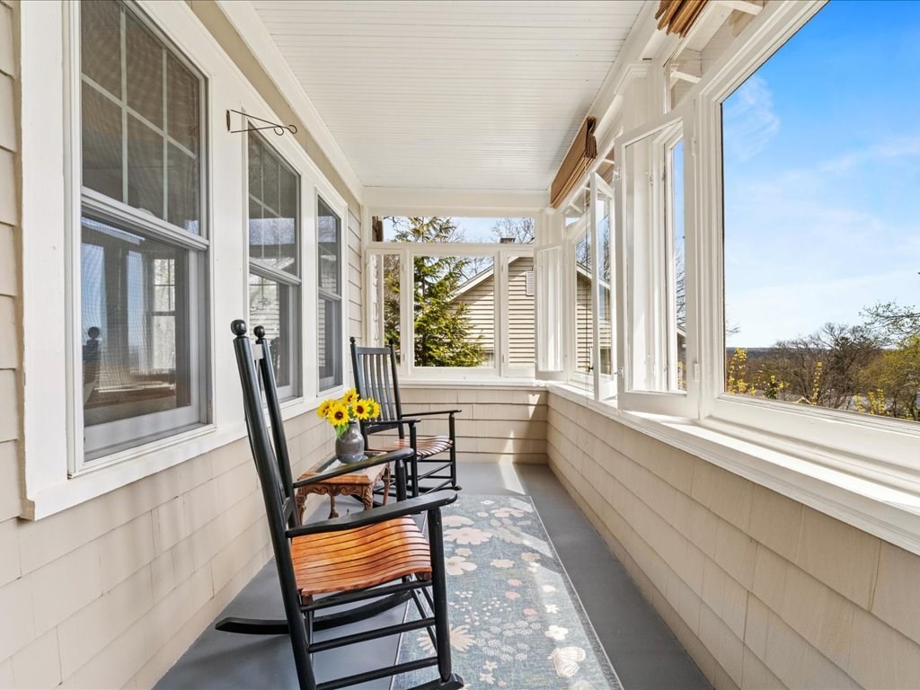 55 Coolidge Road Arlington, MA 02476 - Photo 5 of 42 a view of a two chairs in the balcony