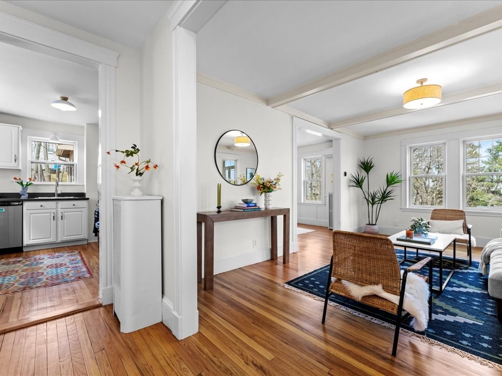 55 Coolidge Road Arlington, MA 02476 - Photo 6 of 42 a living room with furniture and wooden floor