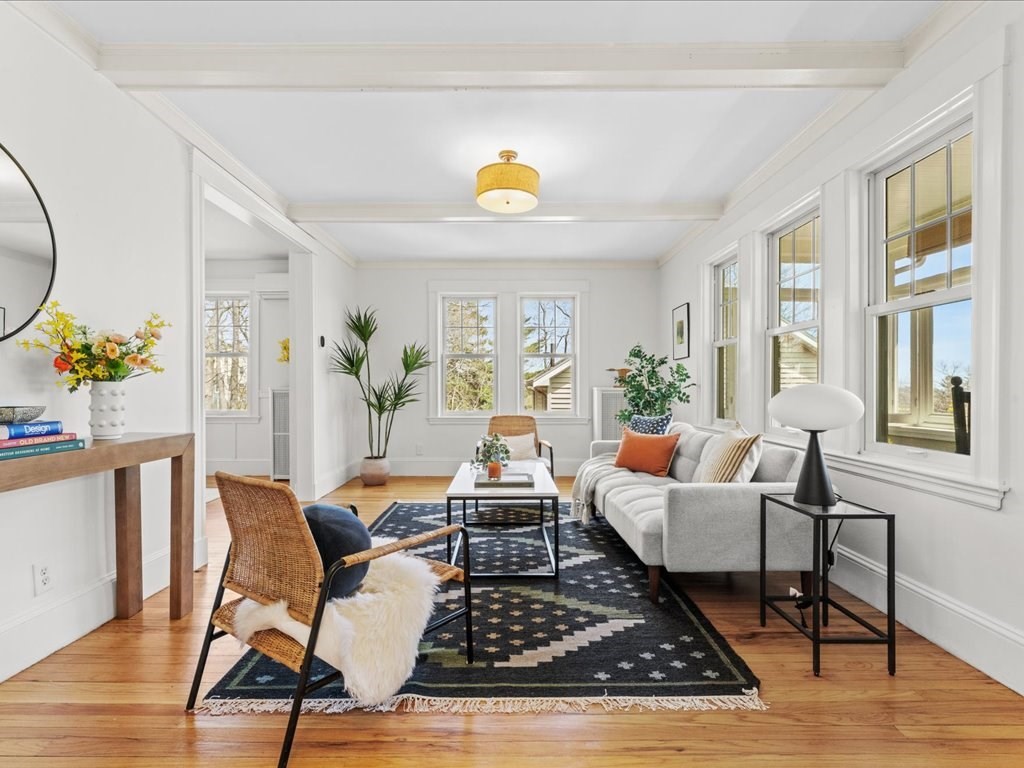 55 Coolidge Road Arlington, MA 02476 - Photo 7 of 42 a living room with furniture and wooden floor