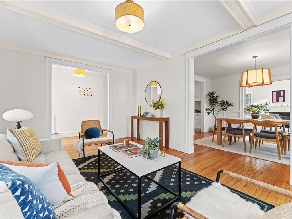 55 Coolidge Road Arlington, MA 02476 - Photo 9 of 42 a living room with furniture and wooden floor