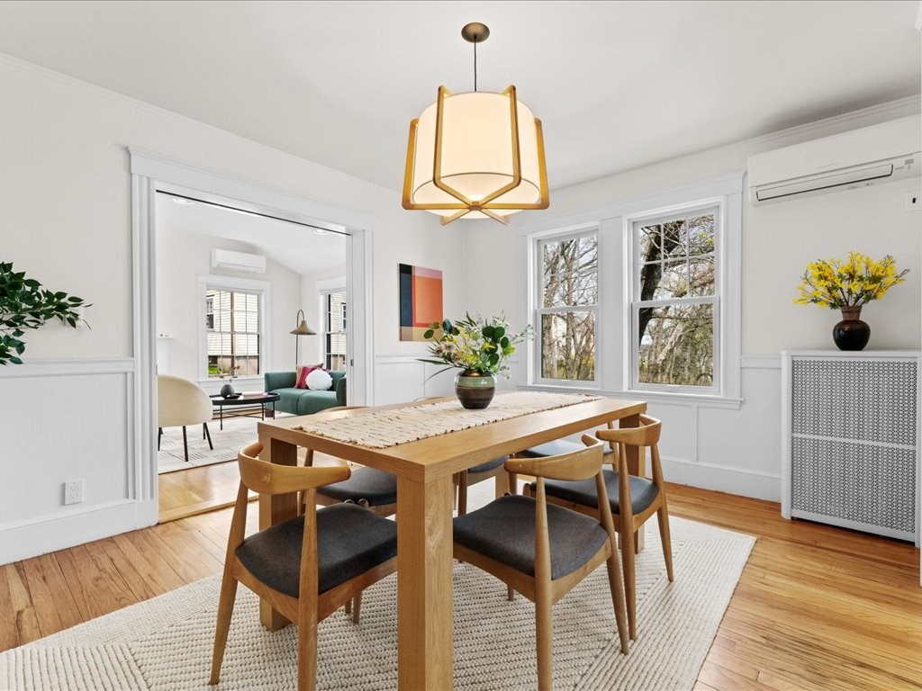55 Coolidge Road Arlington, MA 02476 - Photo 10 of 42 a view of a dining room with furniture and wooden floor