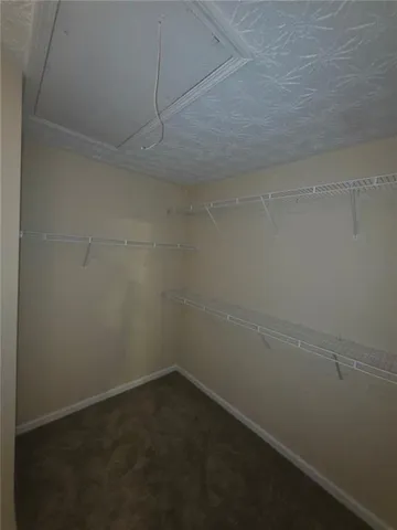 an empty room with a empty space and a ceiling fan