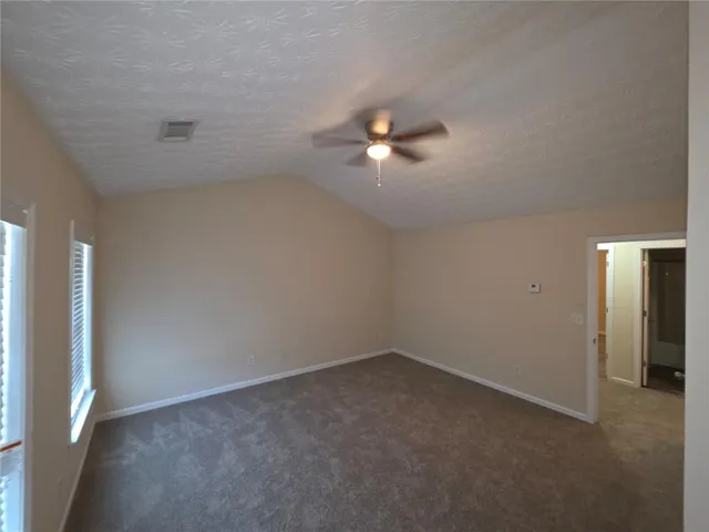 a bathroom with a tub and shower