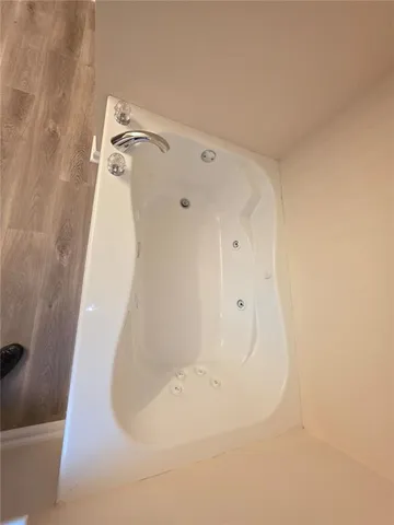 a bathroom with a sink vanity and a mirror