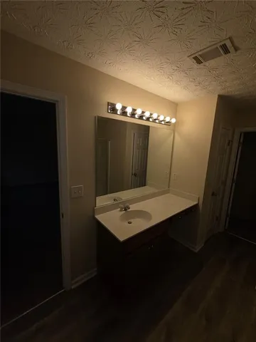 a view of a chandelier fan in a small room