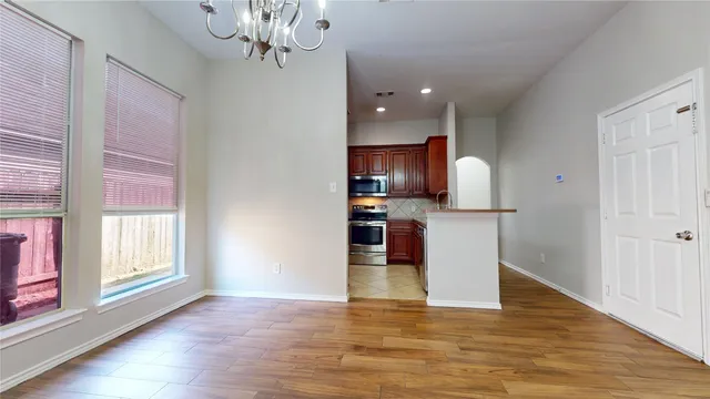 a view of kitchen with granite countertop cabinets and outdoor space
