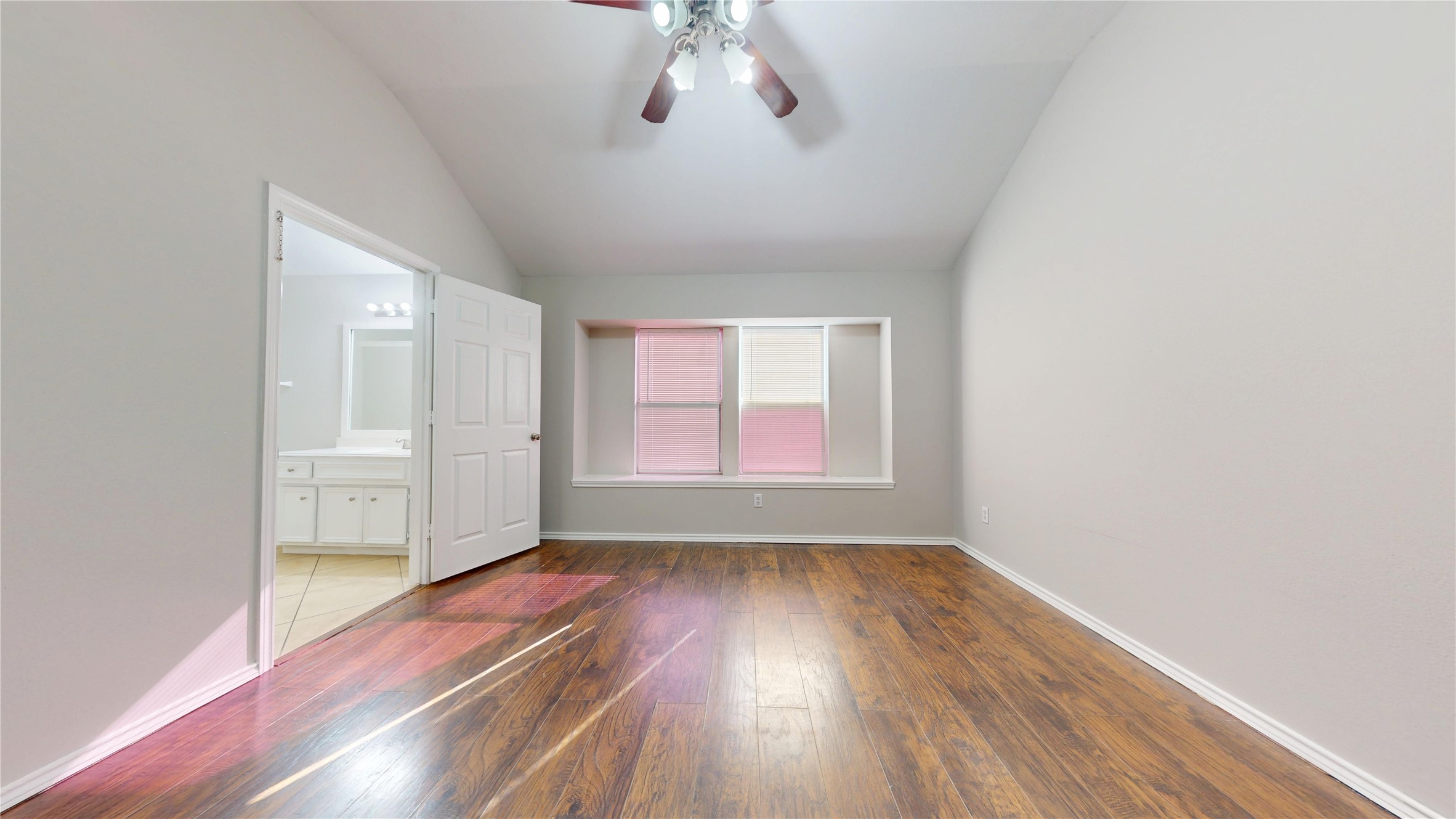 16611 Cheshire Grove Lane Houston, TX 77090 - Photo 19 of 40 wooden floor in an empty room with a window