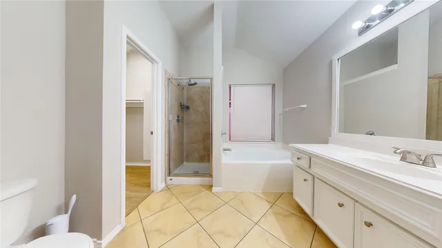 a bathroom with a bathtub and shower