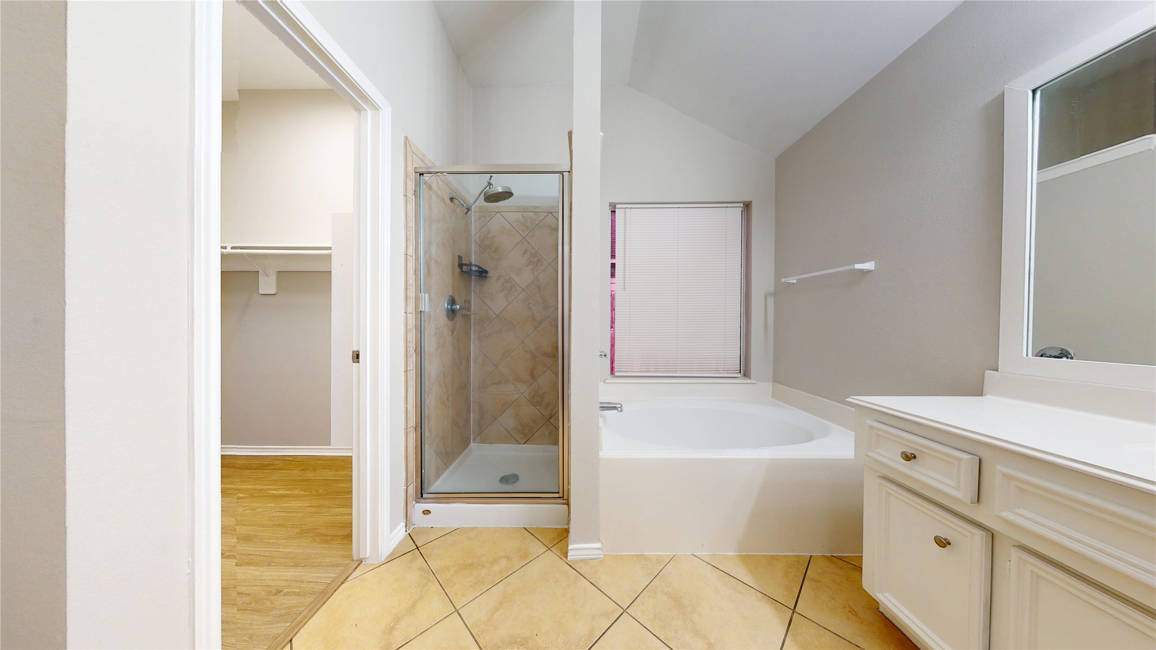 16611 Cheshire Grove Lane Houston, TX 77090 - Photo 23 of 40 a bathroom with a bathtub and shower