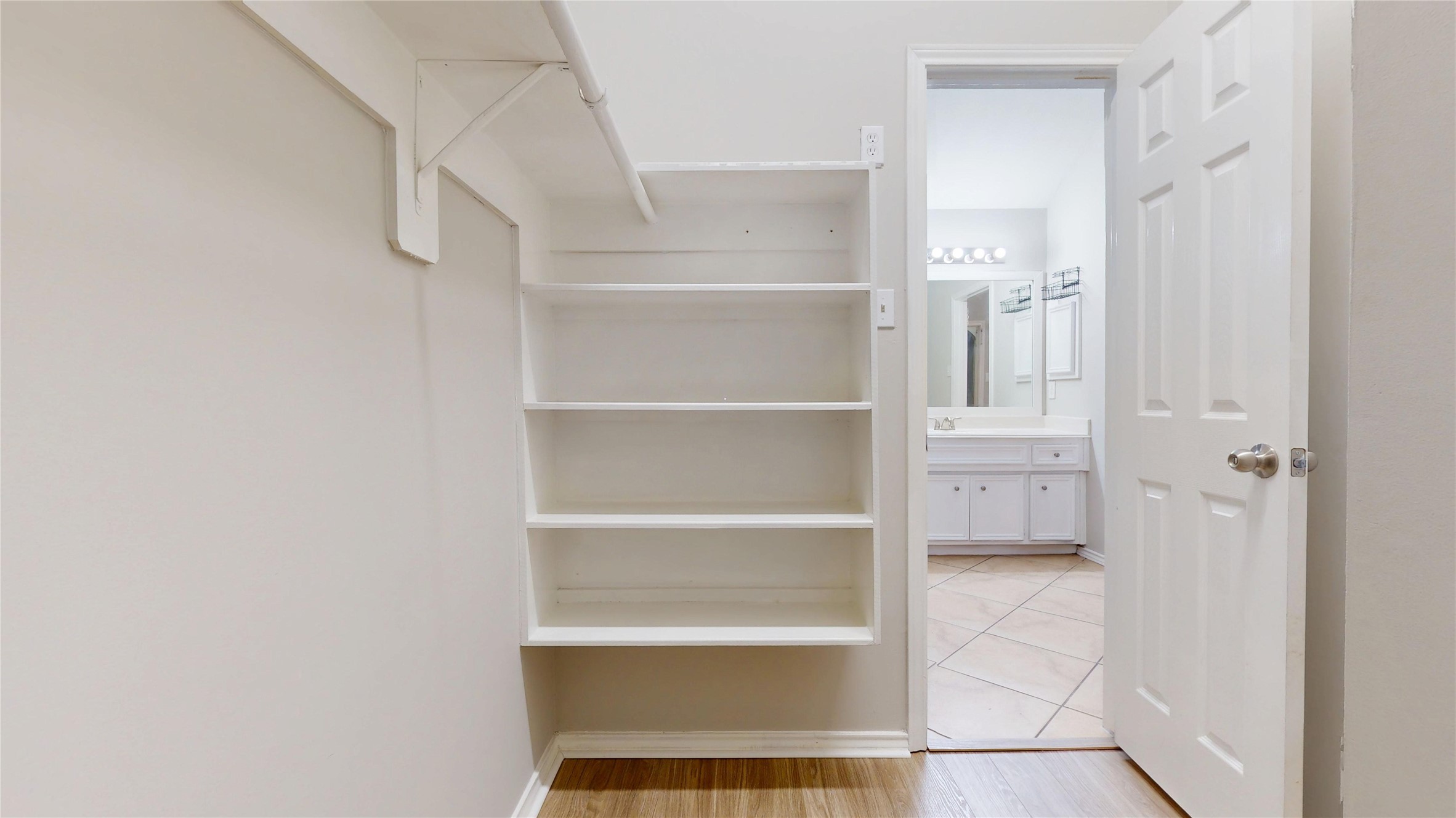 16611 Cheshire Grove Lane Houston, TX 77090 - Photo 27 of 40 a view of walk in closet with empty racks
