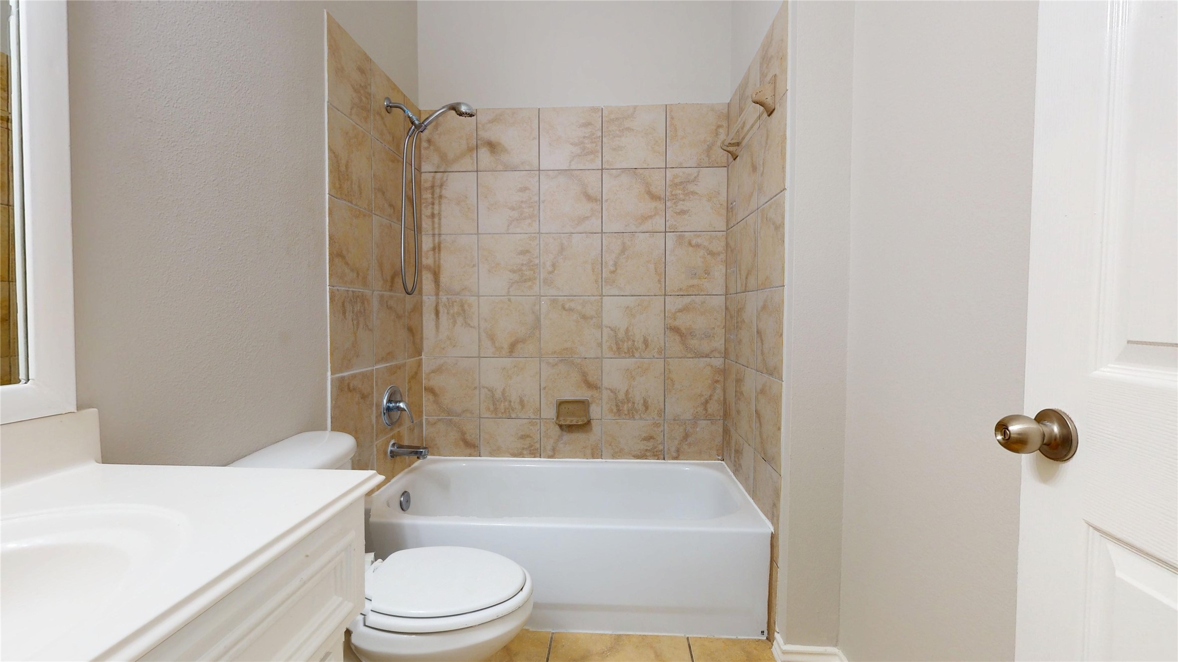 16611 Cheshire Grove Lane Houston, TX 77090 - Photo 29 of 40 a white toilet sitting next to a white tub