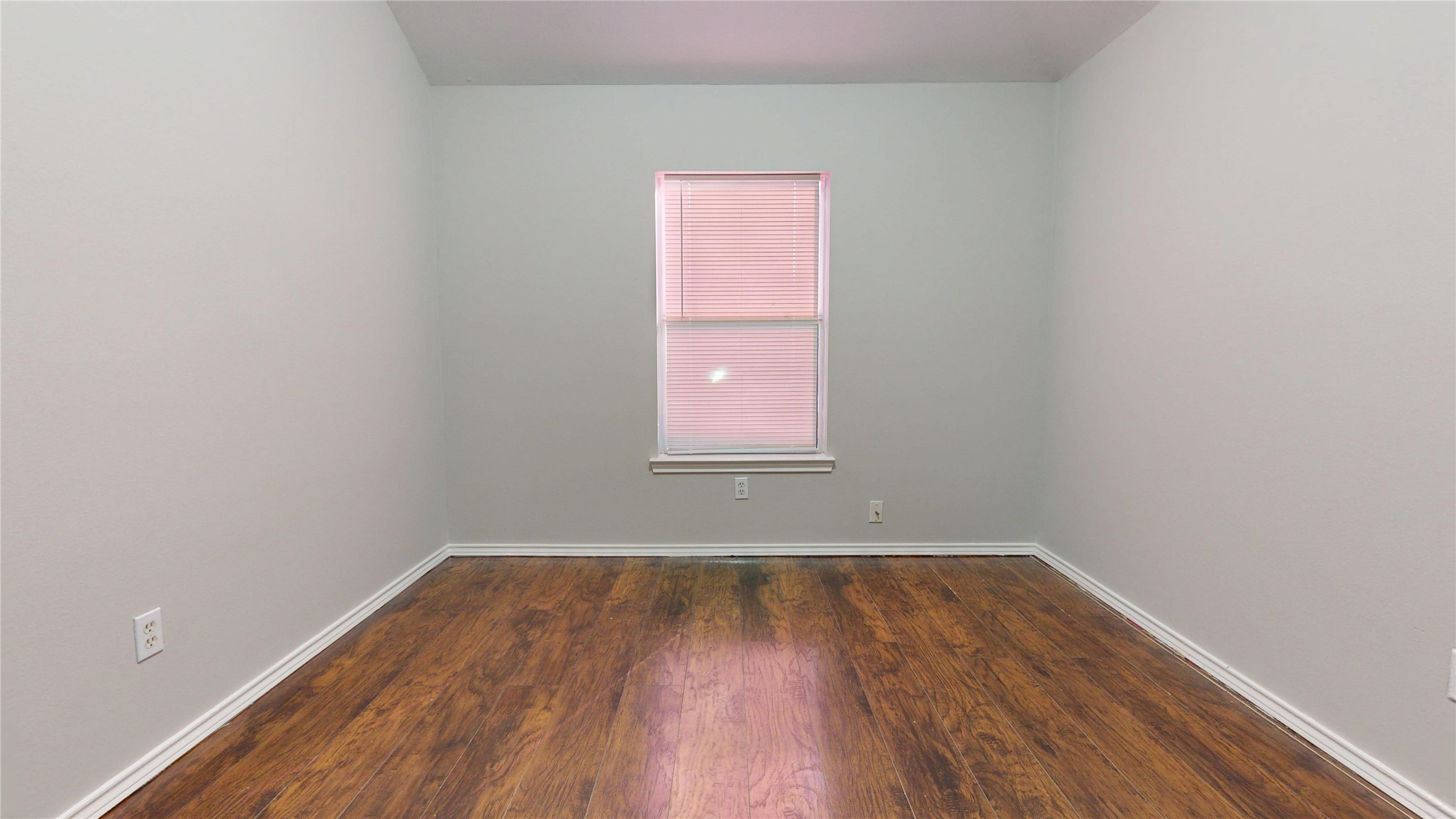 16611 Cheshire Grove Lane Houston, TX 77090 - Photo 31 of 40 wooden floor and window in empty room