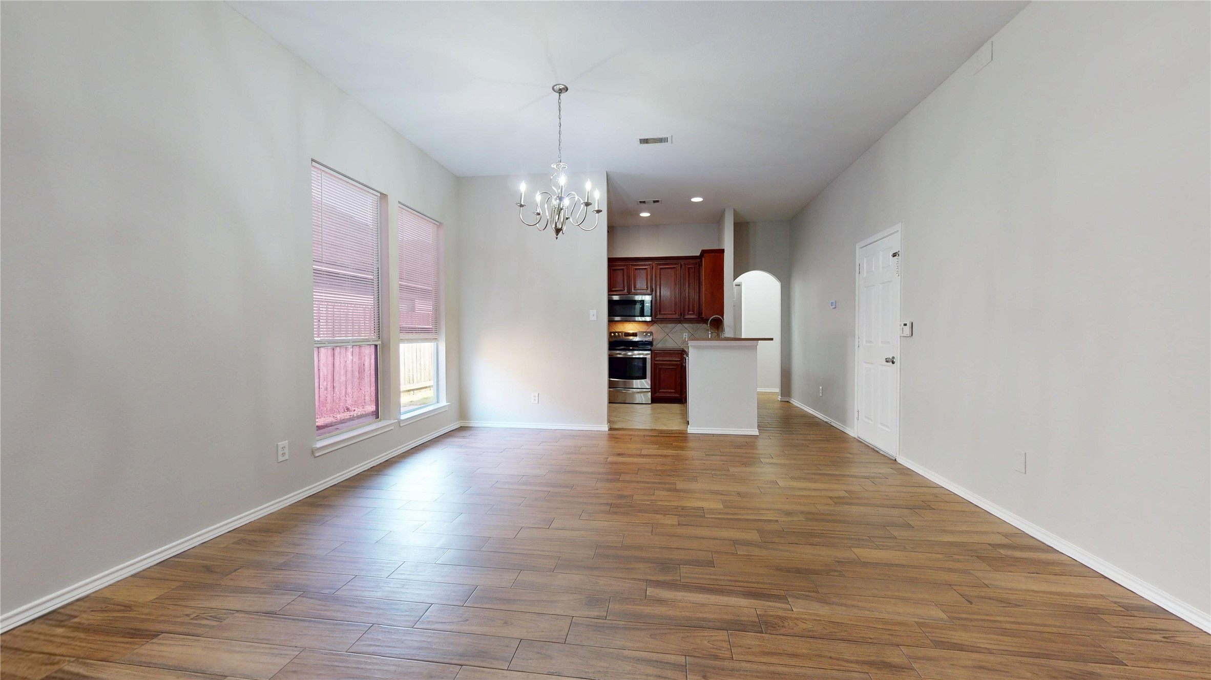 16611 Cheshire Grove Lane Houston, TX 77090 - Photo 8 of 40 a view of a kitchen with a dishwasher cabinets and wooden floor