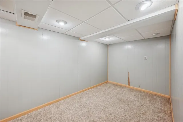 a view of an empty room with a cabinet