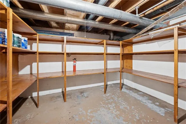 a view of a room with gym equipment and windows