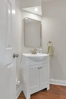 a bathroom with a sink and mirror