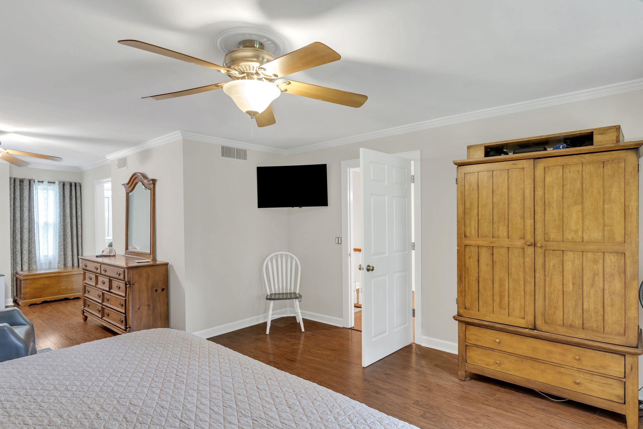 2248 Racquet Club Drive Murfreesboro, TN 37128 - Photo 19 of 41 a bedroom with a bed and a chandelier