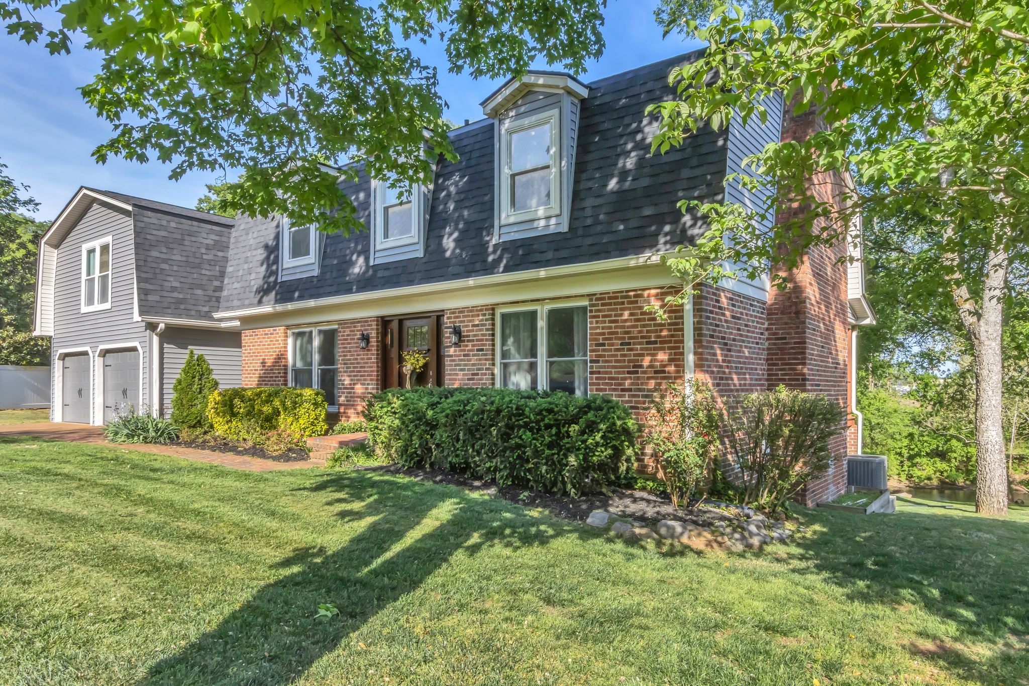 2248 Racquet Club Drive Murfreesboro, TN 37128 - Photo 2 of 41 a front view of a house with garden