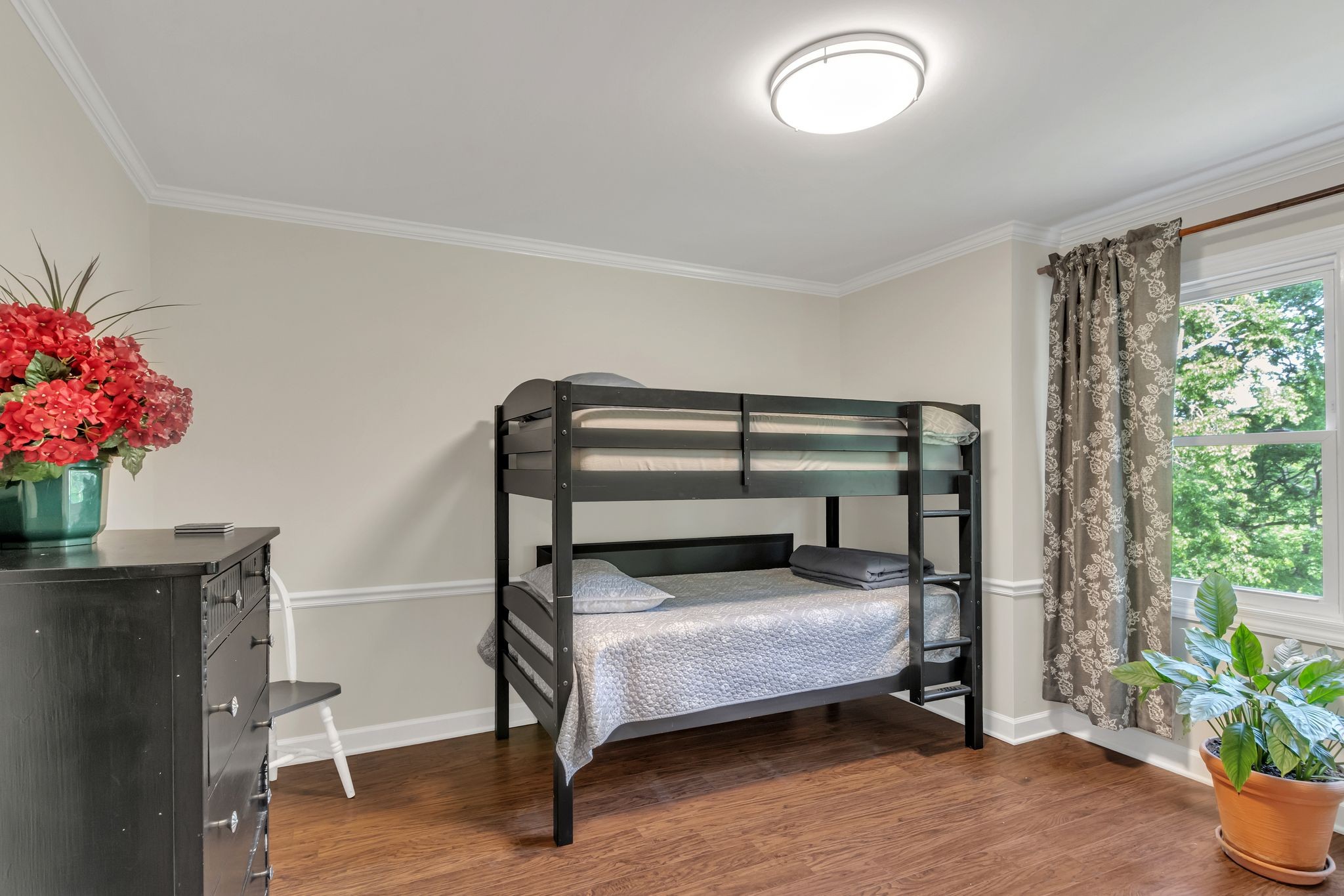 2248 Racquet Club Drive Murfreesboro, TN 37128 - Photo 22 of 41 a bedroom with a bed and a potted plant