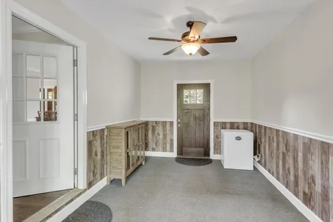 a view of a hallway with windows