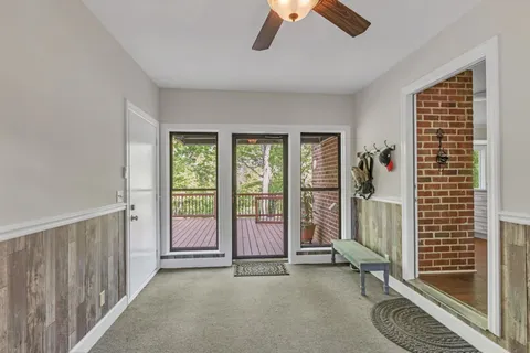 a view of an empty room with glass door