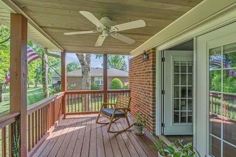a view of a balcony with furniture